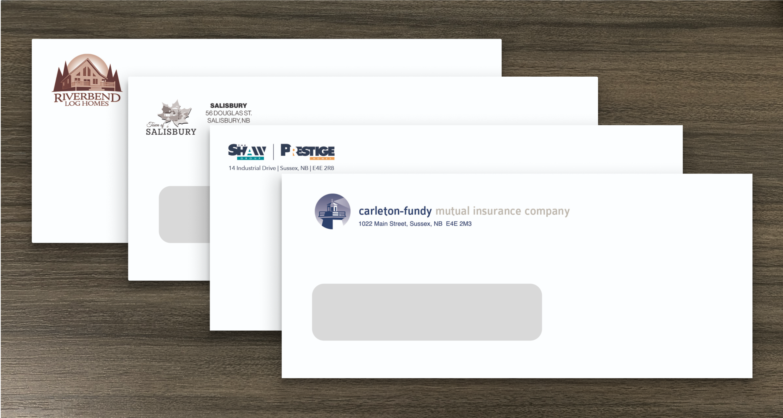 Four different envelopes with custom branding for secure business cheques.