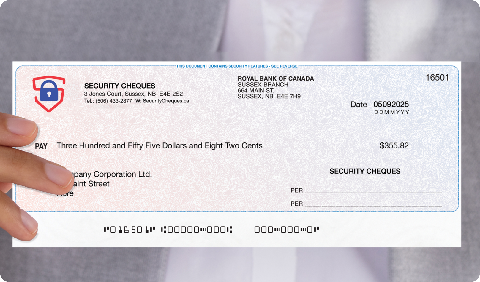 Person wearing a suite holding a secure business cheque for SecurityCheques.ca.