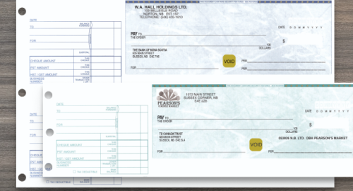 Image Hover – Animation (2) A 2 UP Blue Manual Cheque and a Green 1 UP Manual Cheque on top of a wooden background.